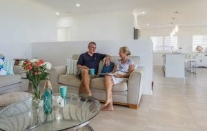 Couple sitting on the couch in their Bundaberg Home